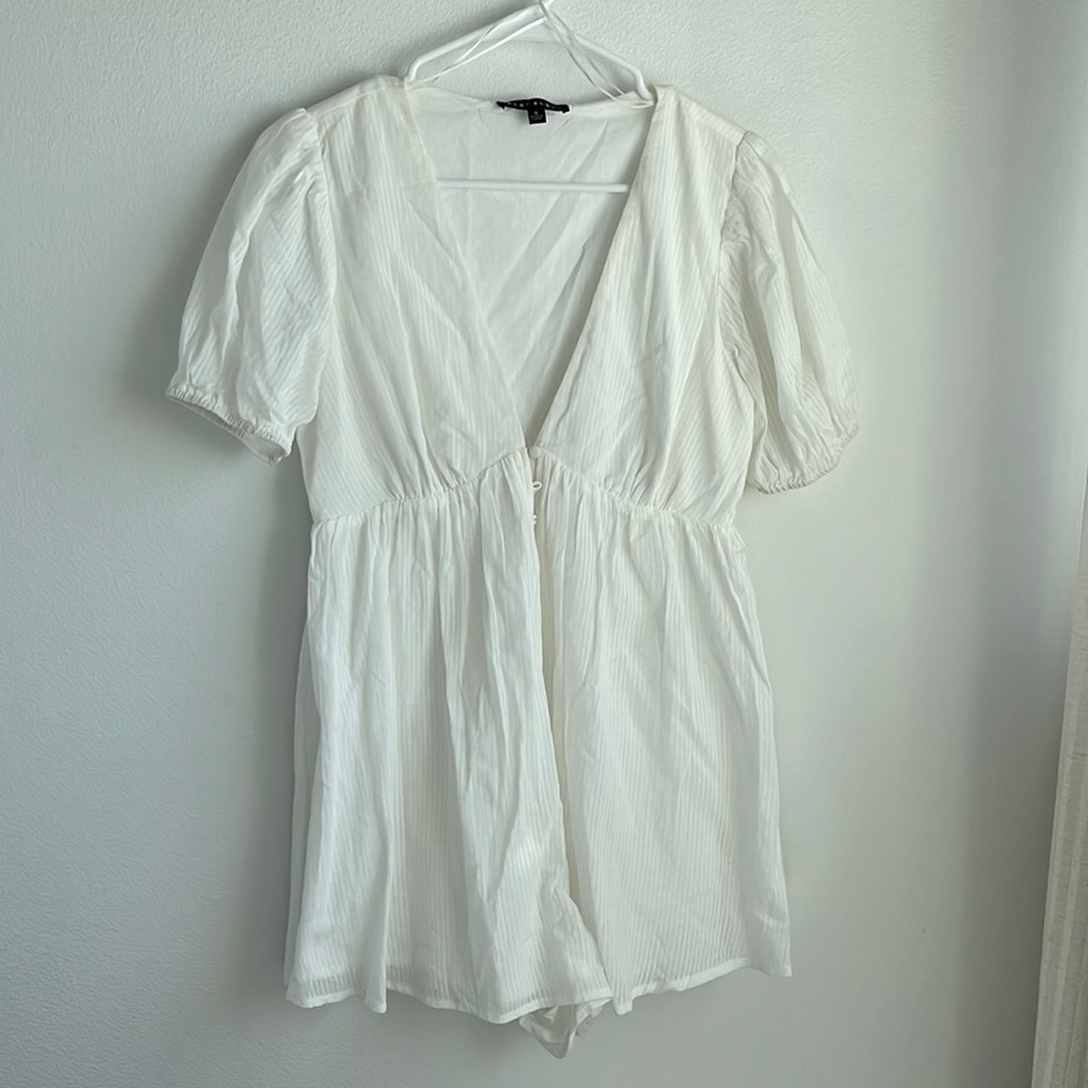 White romper with puff sleeves. Never been worn